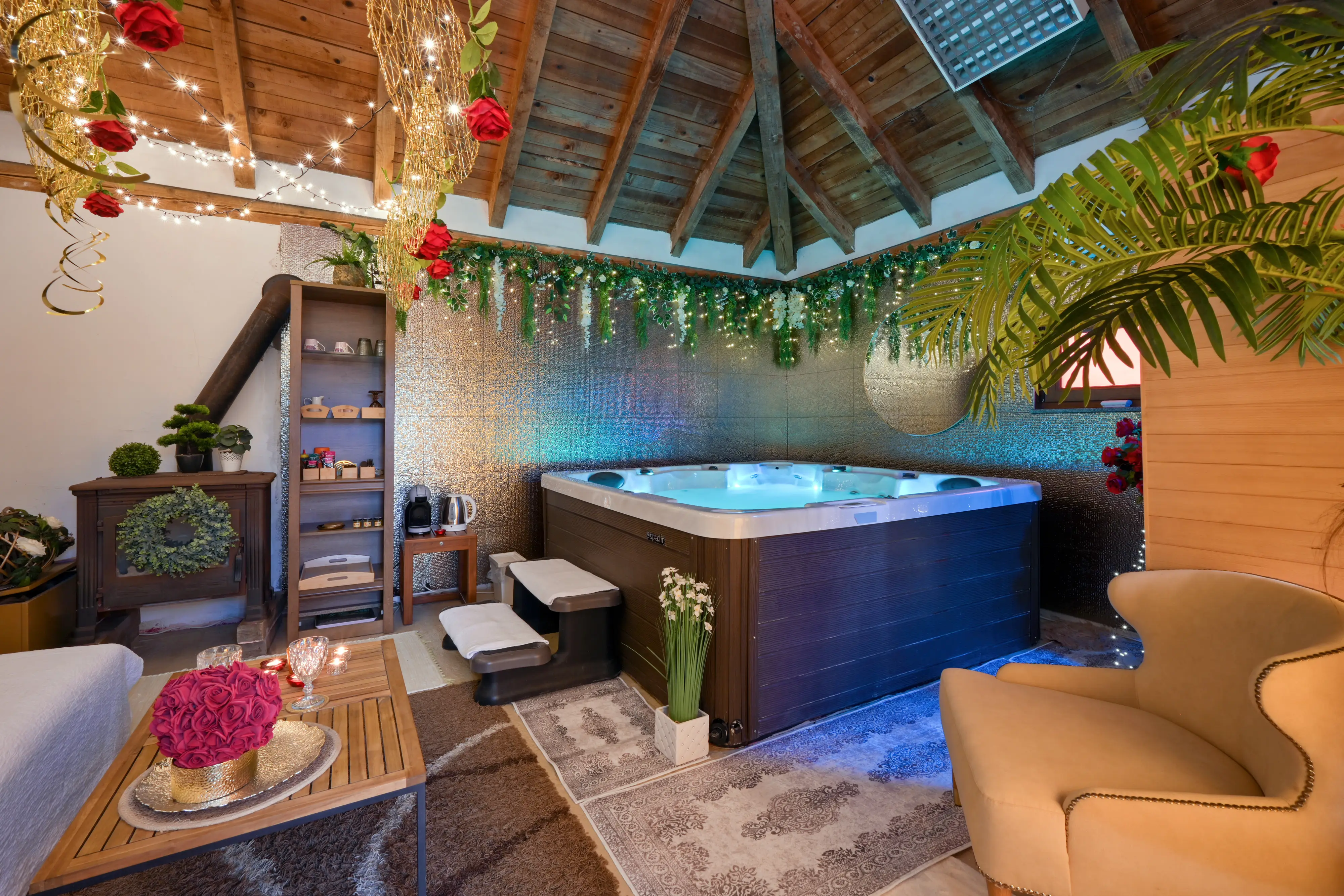 Indoor spa corner with hanging decor, jacuzzi, and warm lights