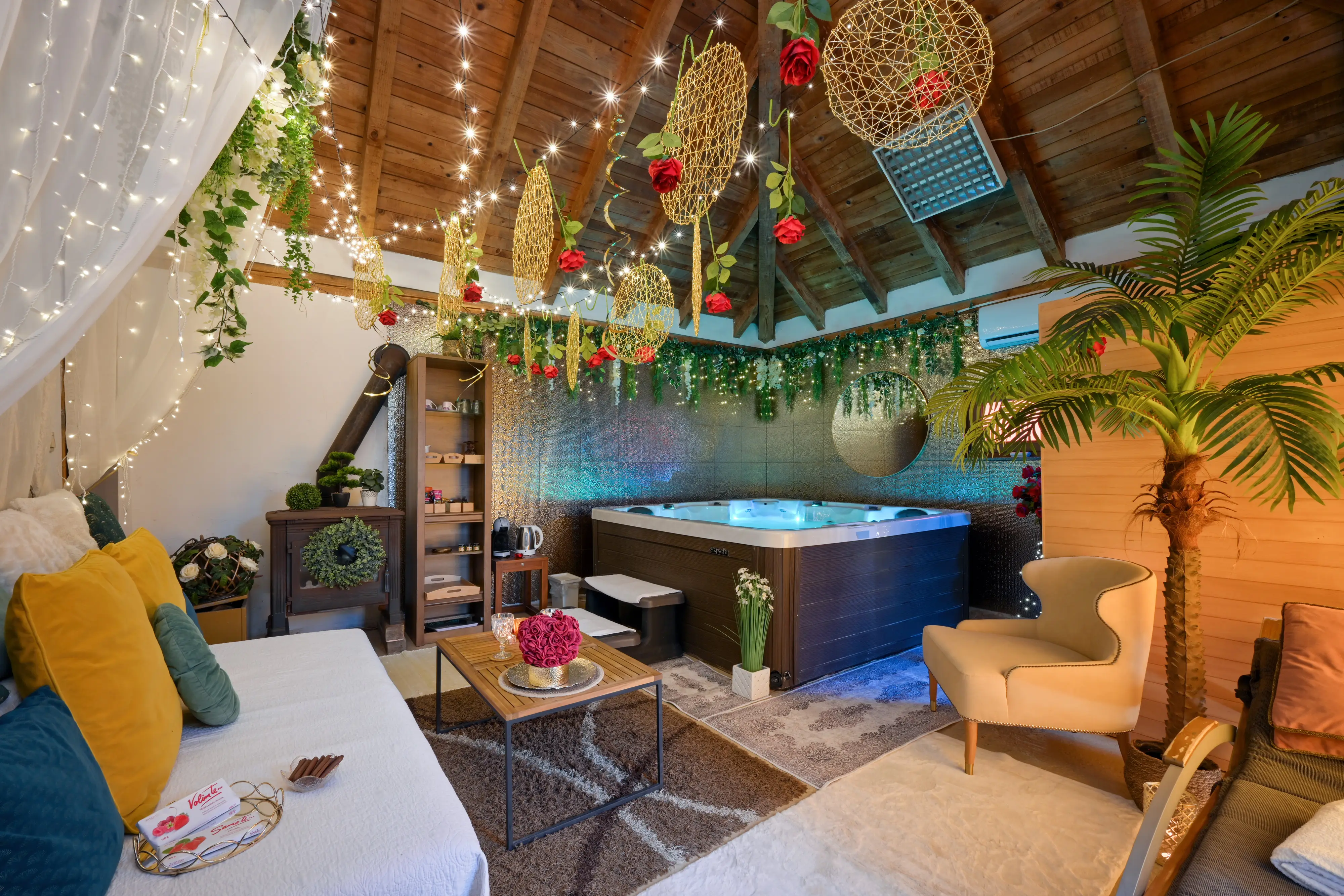 Cozy indoor spa room with sofa, coffee table, and jacuzzi