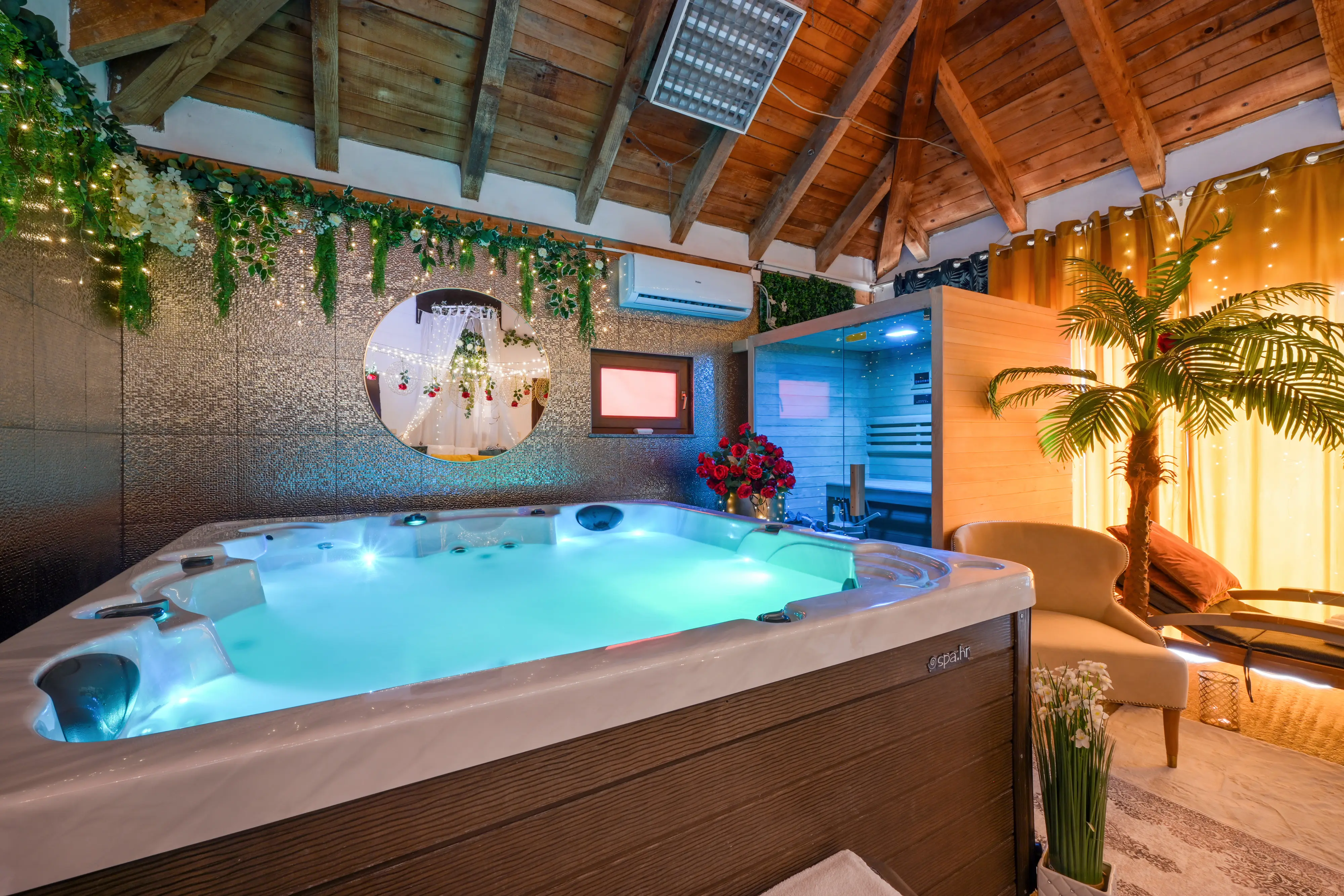 Indoor spa wide with jacuzzi corner and seating area