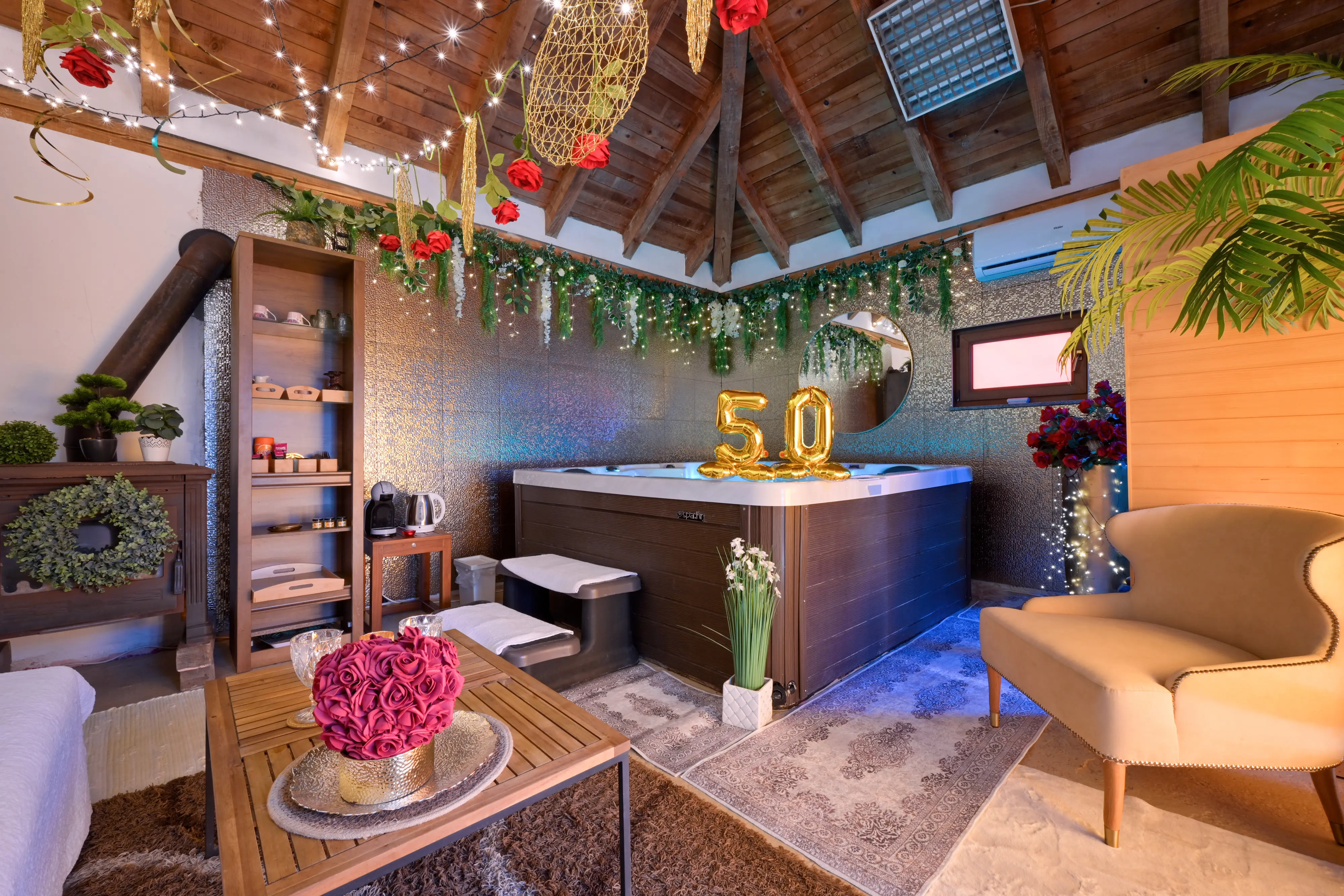 Wide spa setup with gold 50 balloons and jacuzzi