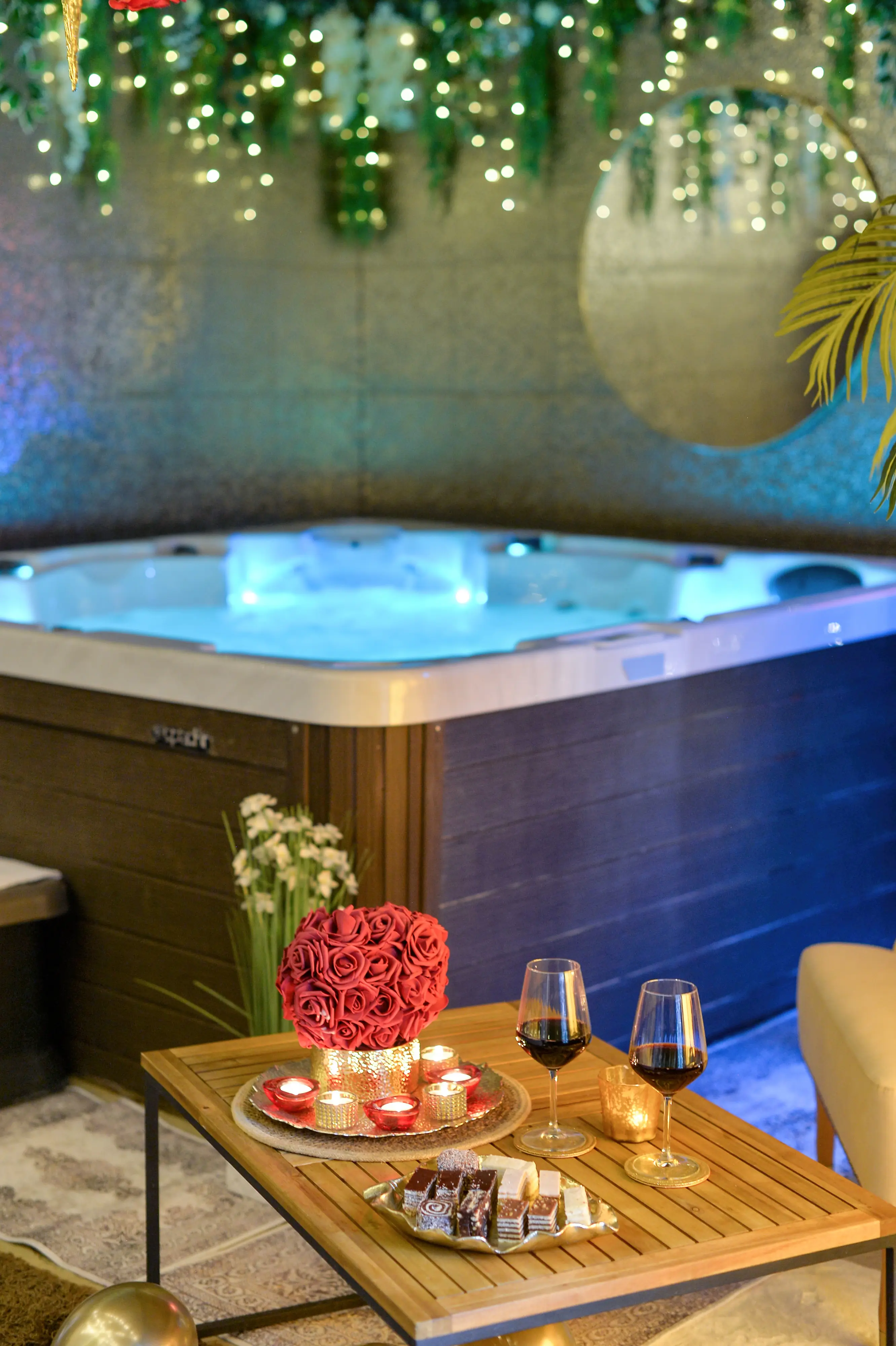 Tight jacuzzi corner shot with flowers and cabinet