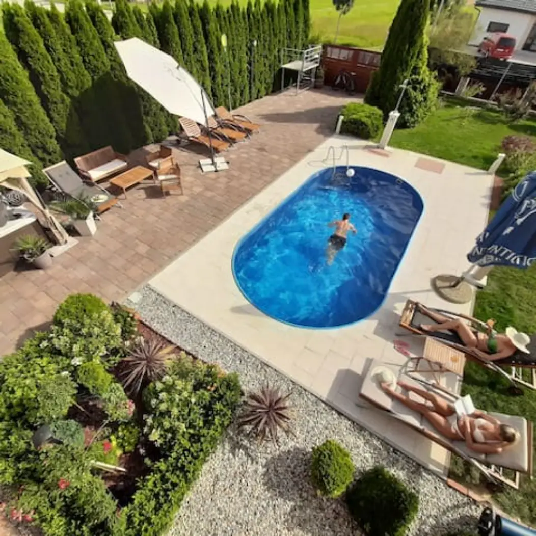 Top-down pool shot with a person swimming