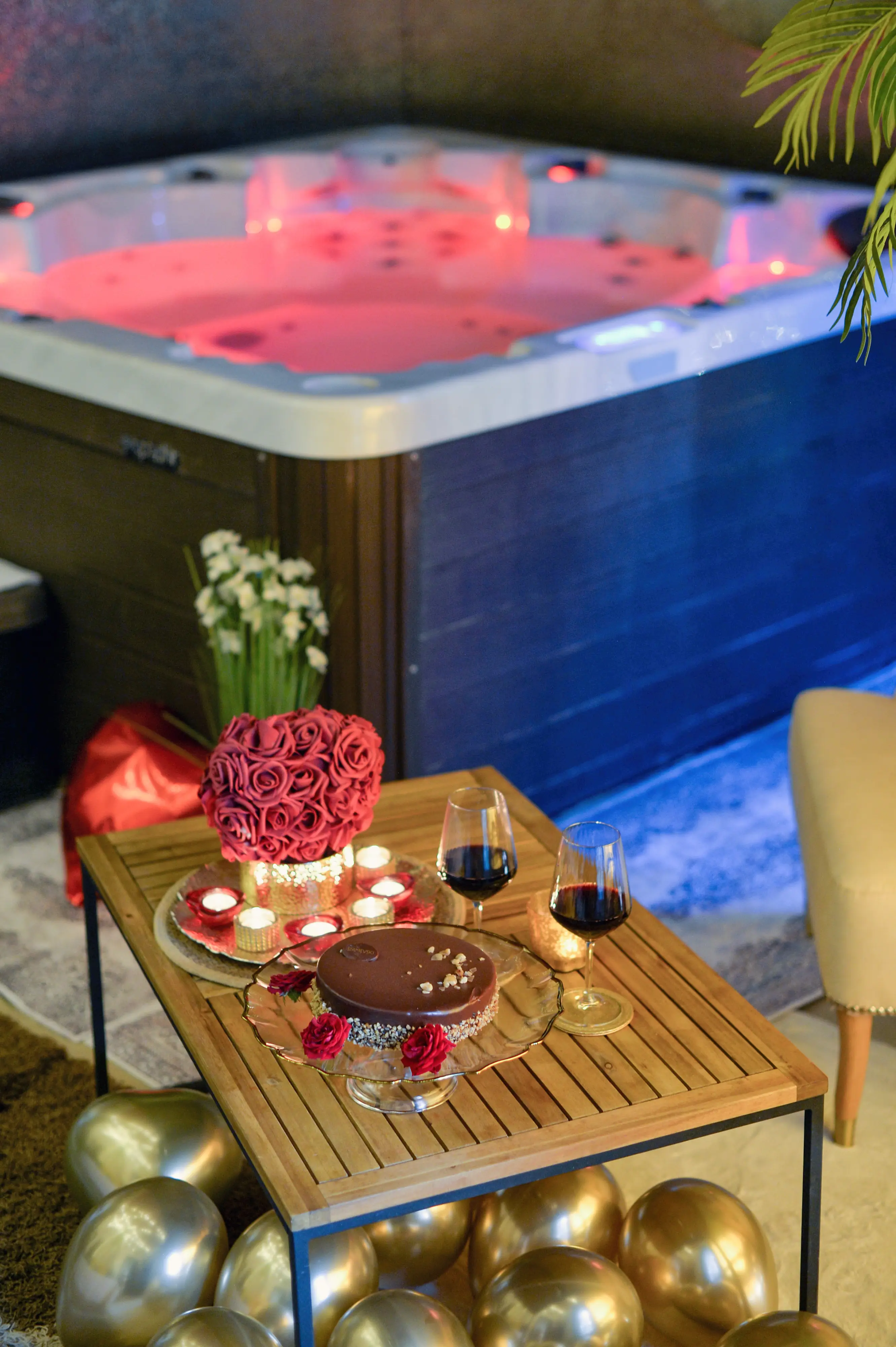 Red cushion and orchid near spa wall