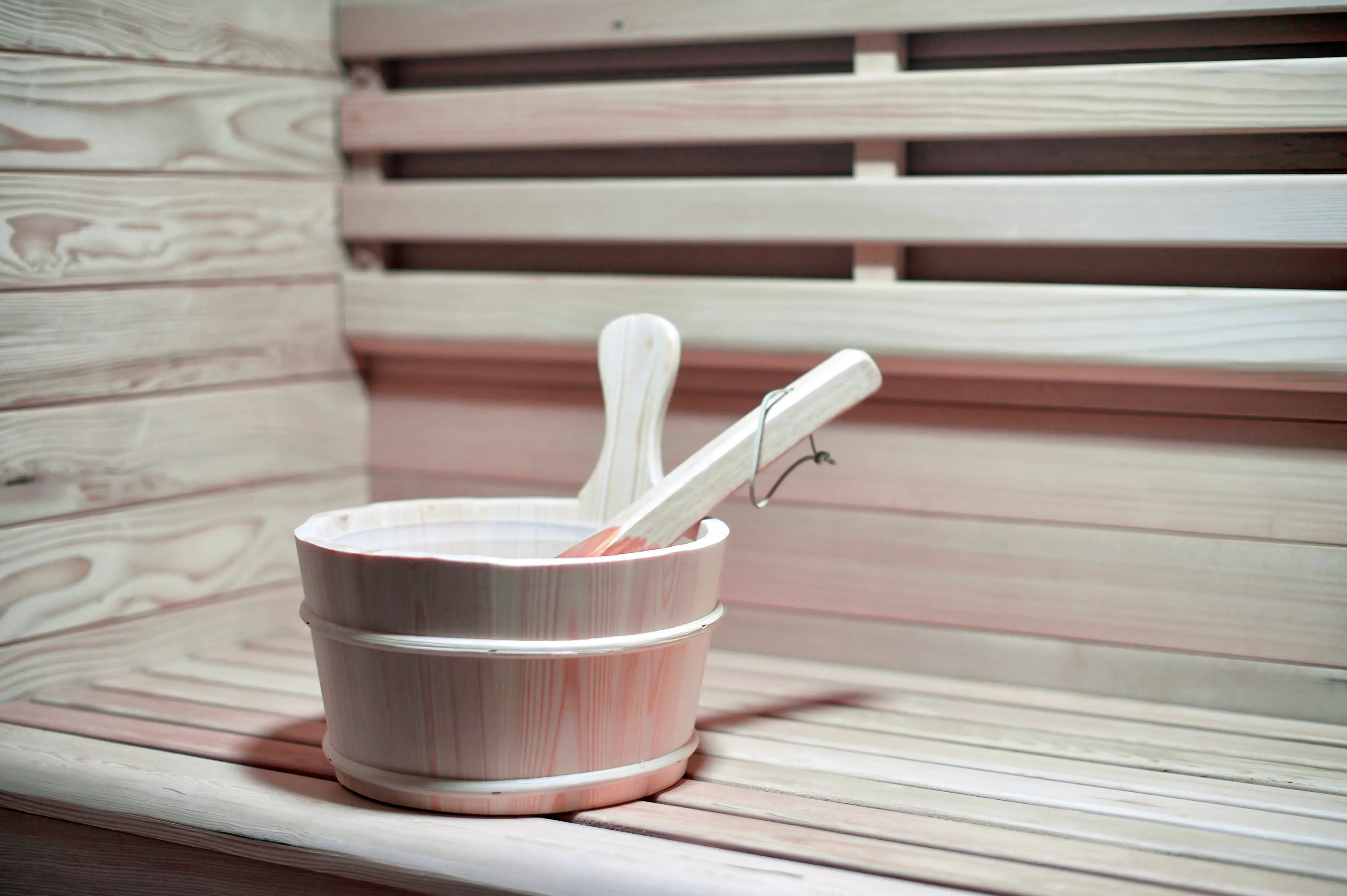 Sauna ladle and bucket close-up on bench